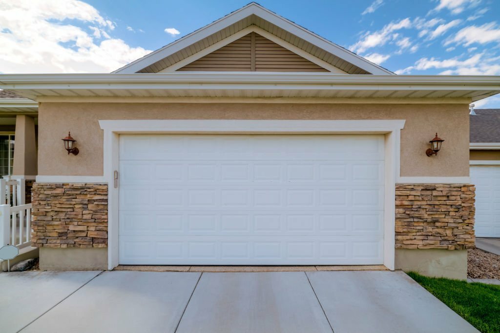 Enhancing Home Value: Garage Door Panel Replacement for Property Upgrades
